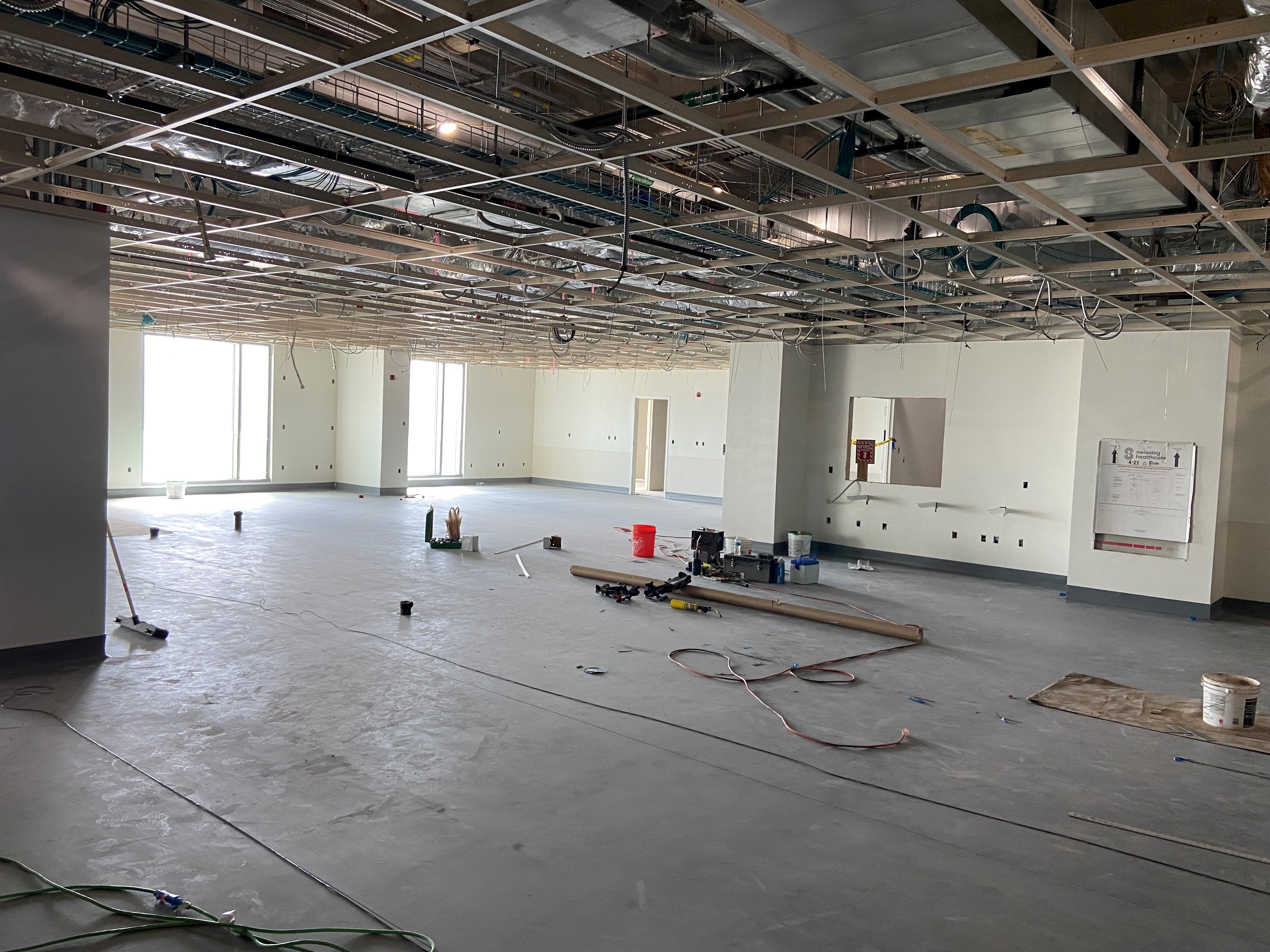 A view of drywall inside a core lab room under construction.