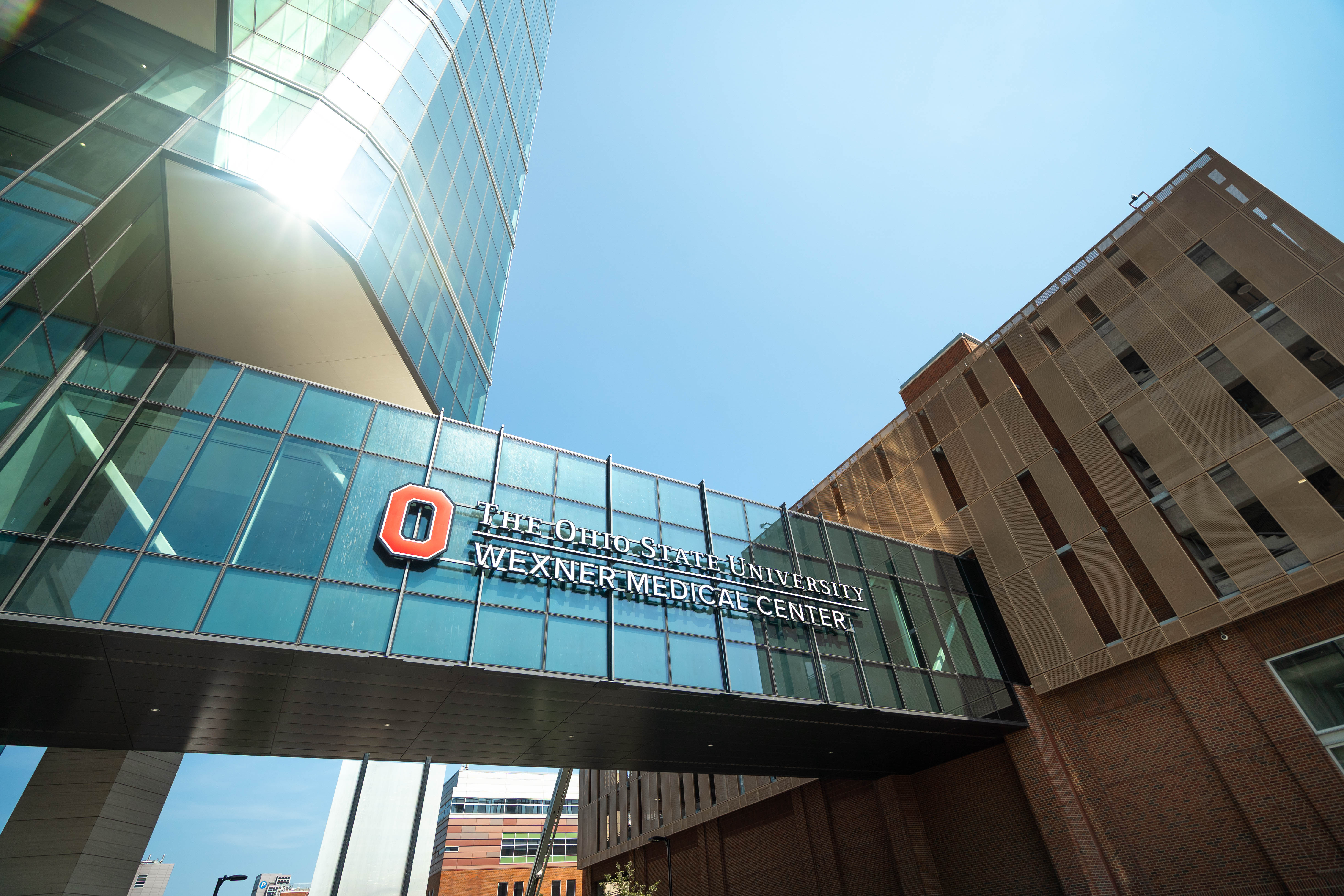 A view of a large sign on a walkway that reads, "The Ohio State University Wexner Medical Center"