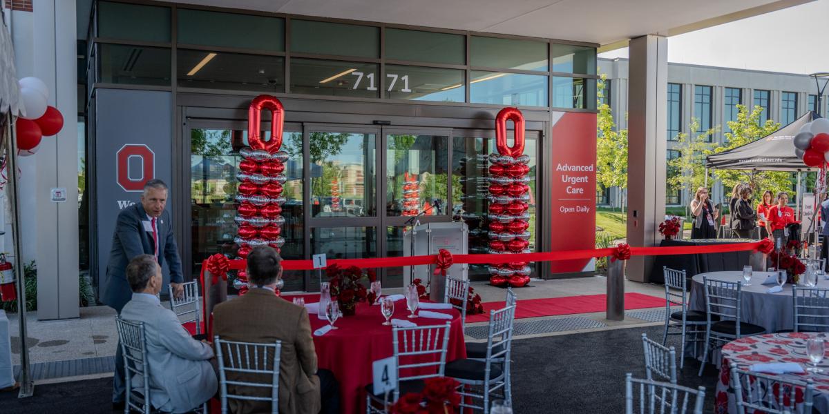 A view of the front doors of the building with Block O and scarlet and gray balloons.