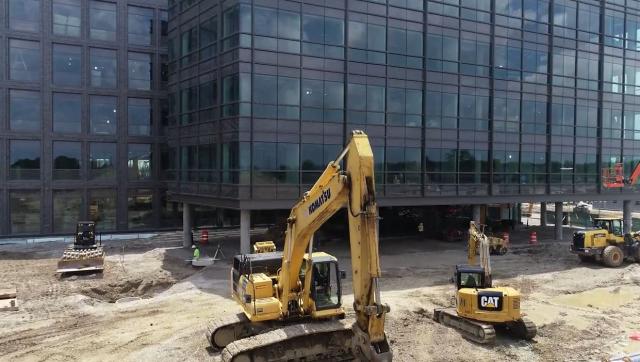 A view of IRF construction with escavator in foreground