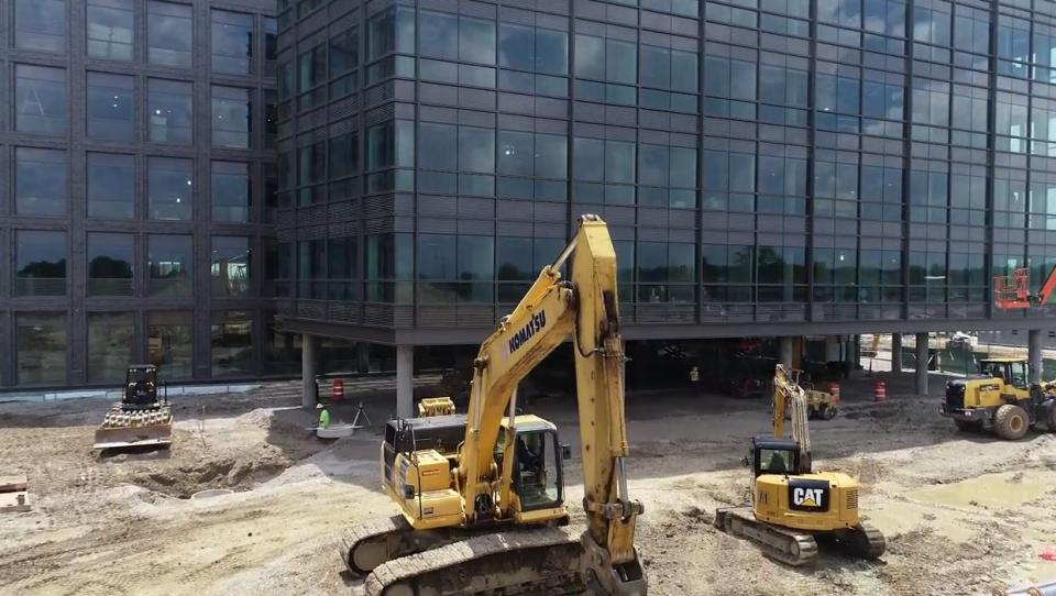 A view of IRF construction with escavator in foreground