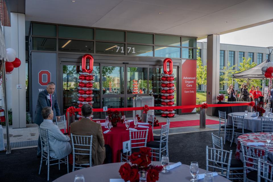 A view of the front doors of the building with Block O and scarlet and gray balloons.