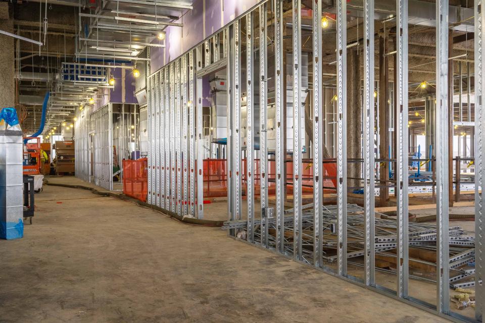 A view of the inside of the building on the second level where crews are installing framing.